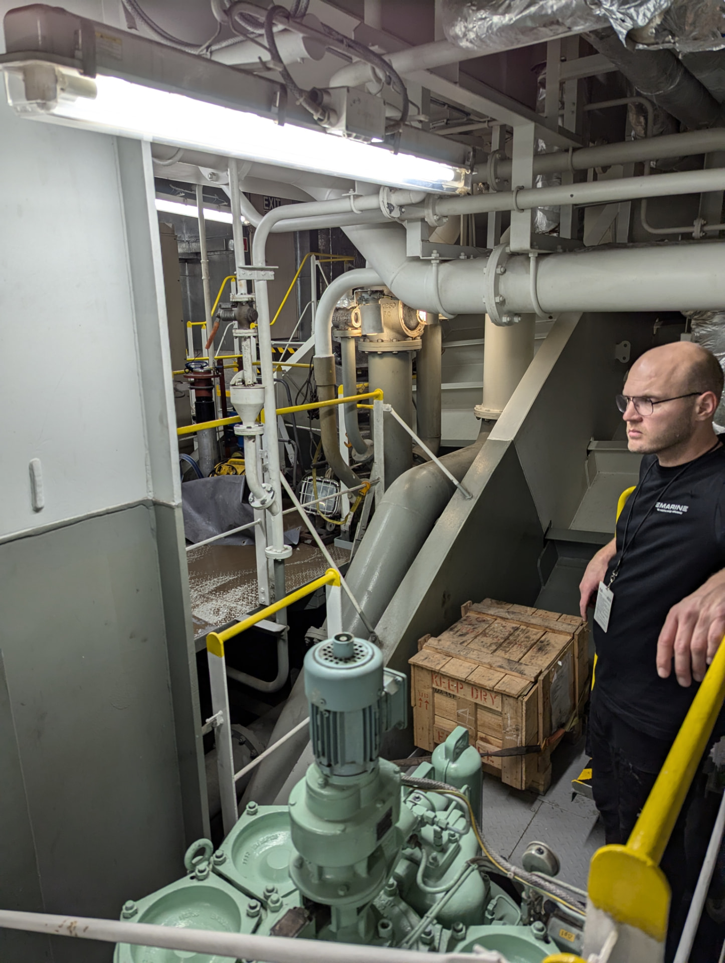 eMarine engineer surveying a vessel machinery space